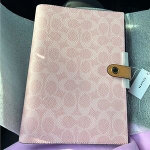 coach powder pink notebook in signature canvas